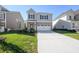 Charming two-story home with a two-car garage and well-maintained lawn at 11847 Rizvan Pl, Covington, GA 30014