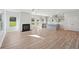 Bright living area featuring a fireplace and open layout to the kitchen at 11847 Rizvan Pl, Covington, GA 30014