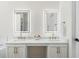 Modern bathroom with illuminated mirrors, and sinks, and marble countertops at 160 Magnolia Walk Ln, South Fulton, GA 30349