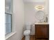 Elegant half bathroom with decorative mirror, modern vanity, and gold accents at 160 Magnolia Walk Ln, South Fulton, GA 30349
