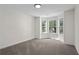 Carpeted bedroom with a bay window allowing for natural light at 160 Magnolia Walk Ln, South Fulton, GA 30349