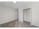 Unfurnished bedroom with carpeted floors, open closet, and ample space for customization at 160 Magnolia Walk Ln, South Fulton, GA 30349