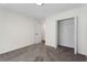 Bedroom featuring carpet floors, white walls, closet, and a partially opened door at 160 Magnolia Walk Ln, South Fulton, GA 30349