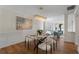 Dining area flows into the living room and boasts a modern chandelier at 160 Magnolia Walk Ln, South Fulton, GA 30349