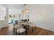 Bright dining area featuring wainscoting, modern chandelier, and an open layout at 160 Magnolia Walk Ln, South Fulton, GA 30349