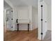 Entryway featuring wood flooring, a console table with decor, and doors leading to other rooms at 160 Magnolia Walk Ln, South Fulton, GA 30349