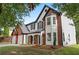 Beautiful two-story house with a brick and siding exterior, landscaped yard at 160 Magnolia Walk Ln, South Fulton, GA 30349