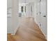 Open hallway leading to front of home with hardwood flooring at 160 Magnolia Walk Ln, South Fulton, GA 30349