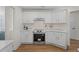 Bright kitchen features white cabinets, marble countertops, stainless appliances, and modern finishes at 160 Magnolia Walk Ln, South Fulton, GA 30349
