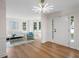 Inviting living room with ample natural light, seating, and wood floors at 160 Magnolia Walk Ln, South Fulton, GA 30349