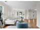 Bright living room features hardwood floors, white walls, and large windows for ample natural light at 160 Magnolia Walk Ln, South Fulton, GA 30349