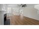 Open living room and floor plan features a fireplace, vinyl floors, and bright natural lighting at 160 Magnolia Walk Ln, South Fulton, GA 30349