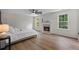 Main bedroom suite with a fireplace, vinyl floors, bright windows and ample natural lighting at 160 Magnolia Walk Ln, South Fulton, GA 30349