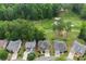 An aerial view showing the property's location on a golf course, highlighting lush greenery and a serene environment at 1701 Tipton Nw Ct, Acworth, GA 30101