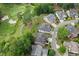 A view of the community nestled on a golf course, showcasing homes with well-maintained landscaping, lush greenery, and mature trees at 1701 Tipton Nw Ct, Acworth, GA 30101