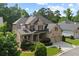 Aerial view of a traditional home with a well-manicured lawn in a suburban neighborhood at 1701 Tipton Nw Ct, Acworth, GA 30101