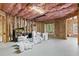 Unfinished basement ready for customization with exposed insulation and framing at 1701 Tipton Nw Ct, Acworth, GA 30101