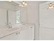 Bathroom featuring double sinks with white countertops and cabinetry at 1701 Tipton Nw Ct, Acworth, GA 30101
