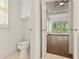 Cleanly-designed bathroom offers a private toilet room and entry to the main bedroom at 1701 Tipton Nw Ct, Acworth, GA 30101