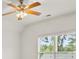 Bright bedroom featuring a ceiling fan and a large double window providing ample natural light and views at 1701 Tipton Nw Ct, Acworth, GA 30101