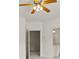 Bedroom featuring doorway to the bathroom with double vanity and ceiling fan at 1701 Tipton Nw Ct, Acworth, GA 30101