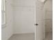 Walk-in closet featuring shelving, a window for natural light and neutral carpeting at 1701 Tipton Nw Ct, Acworth, GA 30101
