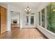 Dining area with hardwood floors, chandelier, and scenic views at 1701 Tipton Nw Ct, Acworth, GA 30101