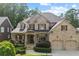 Beautiful brick home featuring a manicured front yard and covered front porch at 1701 Tipton Nw Ct, Acworth, GA 30101