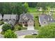 Beautiful home showcasing well-manicured landscaping, a spacious driveway, and a charming exterior on a well-maintained street at 1701 Tipton Nw Ct, Acworth, GA 30101