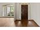 Foyer boasts hardwood floors and a striking front door, creating an inviting entrance to the home at 1701 Tipton Nw Ct, Acworth, GA 30101