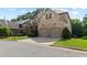 Front exterior view of brick home with manicured landscaping and attached garage at 1701 Tipton Nw Ct, Acworth, GA 30101
