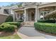 Inviting front porch with stone walkway, columns, and lush landscaping at 1701 Tipton Nw Ct, Acworth, GA 30101