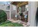 Relaxing front porch featuring rocking chairs, a side table, and manicured shrubbery at 1701 Tipton Nw Ct, Acworth, GA 30101