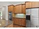 Kitchen with stainless steel appliances, wooden cabinets, and granite countertops at 1701 Tipton Nw Ct, Acworth, GA 30101