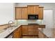 Kitchen with granite countertops, stainless steel appliances, and wooden cabinets at 1701 Tipton Nw Ct, Acworth, GA 30101