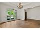 Spacious living room featuring hardwood floors, a large window with outdoor views, and an open layout perfect for entertaining at 1701 Tipton Nw Ct, Acworth, GA 30101