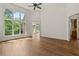 Spacious living room featuring hardwood floors, a large window with outdoor views, and an open layout perfect for entertaining at 1701 Tipton Nw Ct, Acworth, GA 30101
