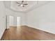 Large main bedroom features hardwood floors, a ceiling fan, and access to the main bathroom at 1701 Tipton Nw Ct, Acworth, GA 30101