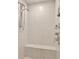 Modern tiled shower with a built-in bench and multiple shower heads for a spa-like experience at 1701 Tipton Nw Ct, Acworth, GA 30101
