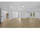 Finished basement area with neutral walls, wood floor, and walk out access at 400 Hunt River Way, Suwanee, GA 30024