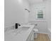 Bathroom featuring modern vanity with stone countertop, and black fixtures at 400 Hunt River Way, Suwanee, GA 30024