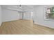 Bright bedroom featuring wood floor, large windows, neutral paint and an ensuite at 400 Hunt River Way, Suwanee, GA 30024