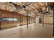 Spacious unfinished garage featuring concrete flooring and exposed ceiling with utilities at 400 Hunt River Way, Suwanee, GA 30024