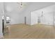 Open concept living room with vaulted ceilings, fireplace, and luxury vinyl flooring at 400 Hunt River Way, Suwanee, GA 30024