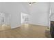 Bright living room featuring vaulted ceilings, stone fireplace, and luxury vinyl flooring at 400 Hunt River Way, Suwanee, GA 30024