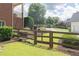 Beautiful backyard with a wood fence and gate, and well-maintained landscaping at 200 Long Needle Ct, Sugar Hill, GA 30518