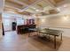 Finished basement with a bar area, tile flooring, and a ping pong table for recreation and entertainment at 200 Long Needle Ct, Sugar Hill, GA 30518