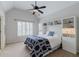 Cozy bedroom with neutral tones, carpet flooring, ceiling fan and vaulted ceiling at 200 Long Needle Ct, Sugar Hill, GA 30518