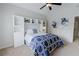 Comfortable bedroom featuring built-in shelving and an ample amount of natural light at 200 Long Needle Ct, Sugar Hill, GA 30518