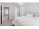 Calm bedroom featuring an open door to an ensuite bathroom, as well as an additional door at 200 Long Needle Ct, Sugar Hill, GA 30518